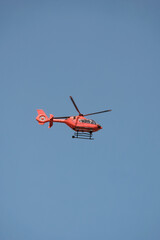 Obraz na płótnie Canvas Rescue helicopter in action. Search and rescue operations at sea. Search and rescue in the mountains.