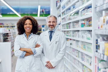 Portrait of a male and female pharmacist, working together at th