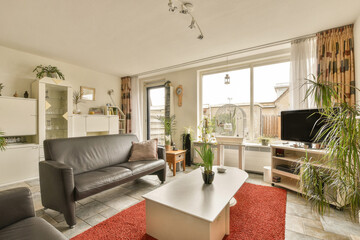 Naklejka premium a living room with two couches, a coffee table and a television set in the center of the room