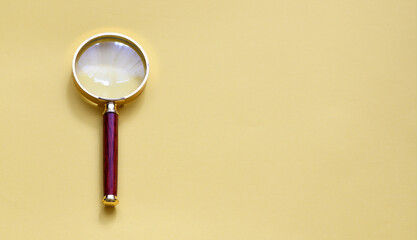 magnifying glass magnifier loupe search symbol on yellow background with copy space