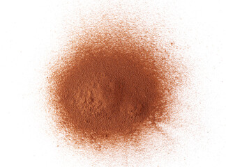 Pile cinnamon powder isolated on white background, with top view
