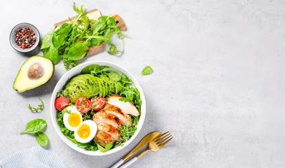Fototapeten Grilled Chicken Fillet with Fresh Salad, Cherry Tomatoes, Boiled Egg and Avocado, Budha Bowl, Keto Paleo Diet Menu © julie208