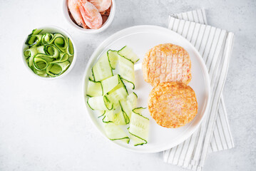 Shrimp patties with cucumber in a plate