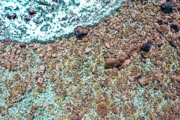 Aerial Serenity: Capturing the Majestic Waves Crashing on the Kona Reef in Hawaii