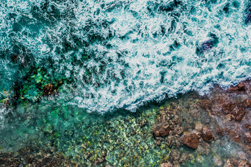 Serenity in Motion: Waves Crashing on Kona's Rocky Coast