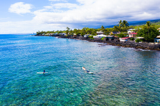 Aerial View: Surfers Anticipating Epic Waves in Kona