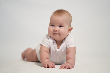 Smiling newborn baby. the photo was taken against a light background