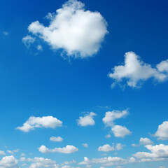 Naklejka na ściany i meble Bright blue sky with white clouds.