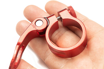 Red aluminum seat clamp isolated above white background with copy space