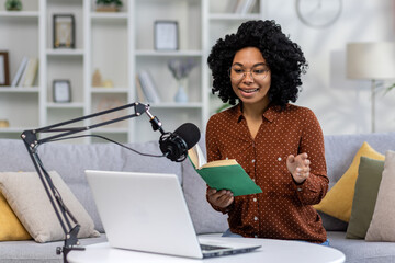A young African-American woman journalist, blogger conducts a podcast, broadcast remotely from...
