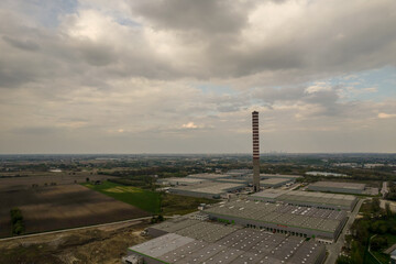 Warehouse halls, logistics, black clouds, aerial photo, chimney, CHP plant