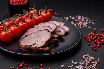Delicious beef steak with salt, spices and herbs on a ceramic plate