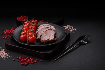 Delicious beef steak with salt, spices and herbs on a ceramic plate