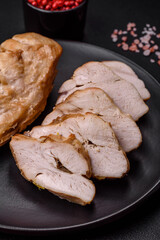 Delicious fresh grilled chicken fillet with salt, spices and herbs on a ceramic plate