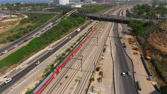 Tel Aviv Ayalon freeway traffic and passenger train, Aerial view