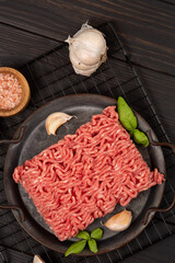 Raw homemade minced meat on a tin plate