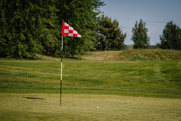 red and white checkered flag in golf course