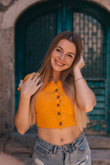 Outdoors portrait of beautiful young girl laughing