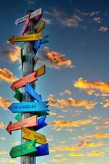 Tourist trunk singpost with colorful signs with distances to the different tourist destinations...