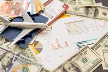 Toy plane on Euro cash background, travel with airplane. Conceptual image of the price of airline...
