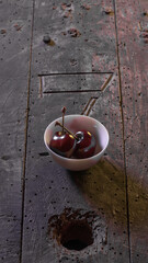 Two cherries in wood