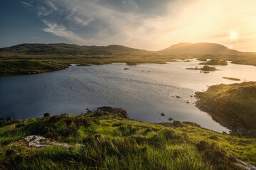 Fototapeta na wymiar Breathtaking landscape sunset scenery of lakes and mountains at Connemara National park in County Galway, Ireland 