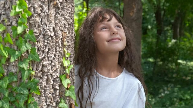 Dreamy girl enjoy botany plants. A dreamy young girl have a rest in the eco forest. A concept of save the planet green and nice.