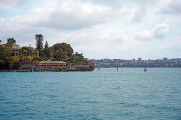 View of Admiralty house and Kirribilli from the ferry, a harbourside suburb on the Lower North Shore of Sydney Harbour.