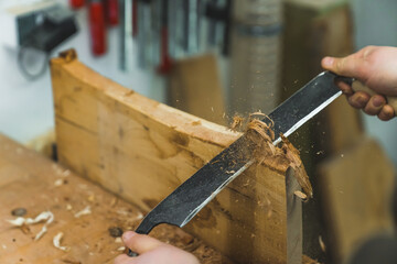 working on wood with a jack plane, the carpenter's tools. High quality photo