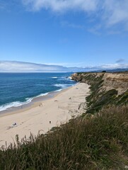 Pacific Ocean beauty: coastal cliffs, azure skies, and turquoise waters