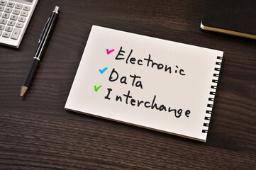 There is notebook with the word Electronic Data Interchange. It is as an eye-catching image.