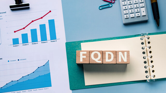 There is notebook with the word FQDN. It is an abbreviation for Fully Qualified Domain Name as eye-catching image.