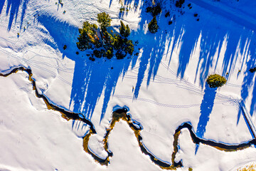Winter Wonderland: A Serene Winding Stream in Utah's Snow-Covered Cottonwood Valley