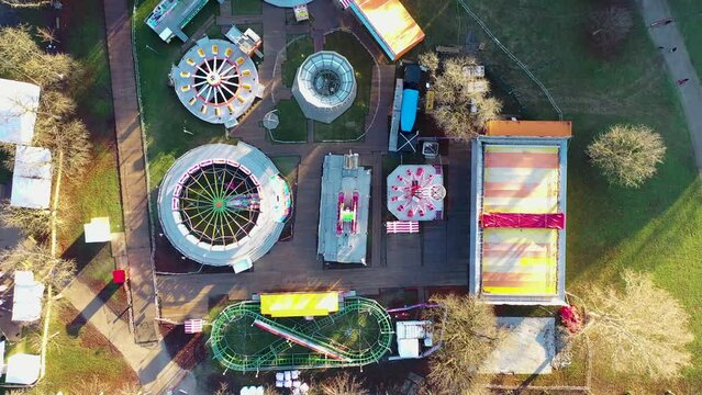 Aerial view of a theme park with Ferris wheel at Trg Franje Tudjmana park at sunset in Zagreb downtown, Croatia.