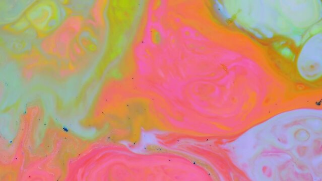 Fluid Art. Liquid paint mixing video with splash and swirl. Background movement with multicolored overflows