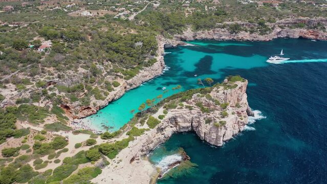 Aerial view of S'Almonia beach, a bay with rugged cliffs, Cala Ignacio Laino, Balearic Islands, Spain.