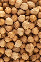 Raw chickpeas in full frame. The concept of vegetable protein. Horizontal frame. 