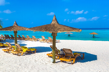 Sun bed and parasol at tropical beach