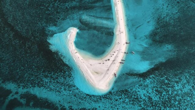 Aerial view of people on White Island along Camiguin Island coastline, Philippines.