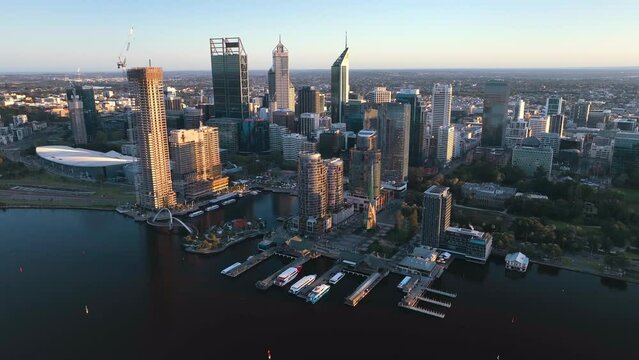 Aerial view Perth downtown with a small harbour at sunset along the Swan River, Western Australia, Australia.