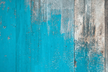 Brown boards. delaminated paint on wooden background. Wooden texture background with old paint peels.Shabby wooden wall