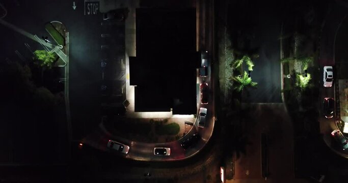Cars going threw a drive thru fast fast food restaurant. Top down view drone flight.