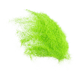 Small size green Sand flying explosion, vegetable sands grain wave explode. Abstract cloud fly. Green colored sand splash throwing in Air. White background Isolated high speed shutter, throwing freeze