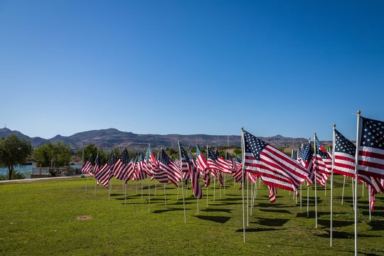 Hundreds of flags fly over a park field in Henderson, Nevada for Memorial Day