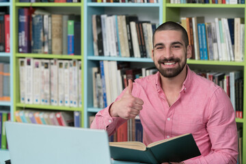 Portrait of Clever Student and showing Thumbs Up