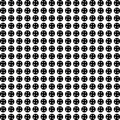 Black circles with small holes create texture