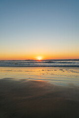 Fototapeta na wymiar Watching the sunset at Funston Beach in California