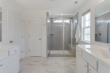 Modern Spring Primary Bathroom with Subway Tile Backsplash and White Double Vanity