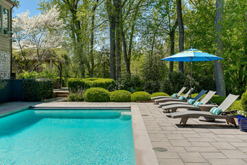 Luxury Modern Swimming Pool Resort Style with Sun Tanning Beds and Crystal Clear Water