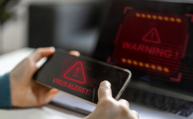 Human use smartphone with red triangle caution warning sign for notification error, programmer,...